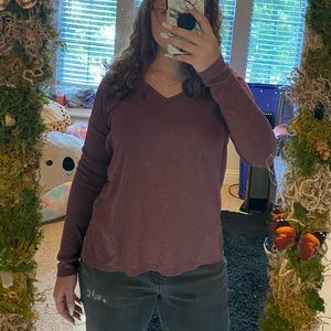 Maroon color long sleeved blouse with semi open back.